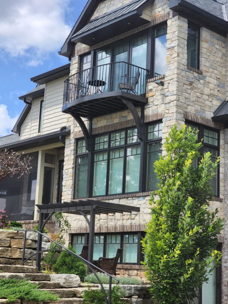 Home with grey walls and a balcony
