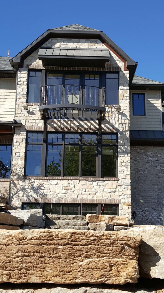 Home with grey walls and a balcony