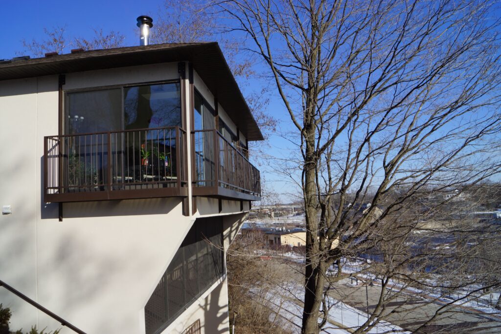Home, tree, balcony and the sky