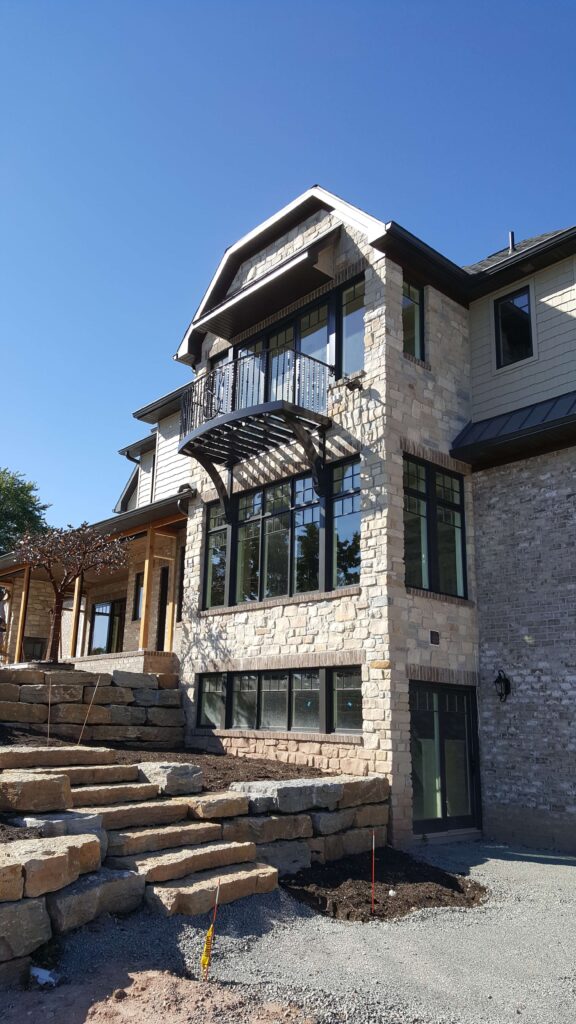 Home with grey walls and a balcony