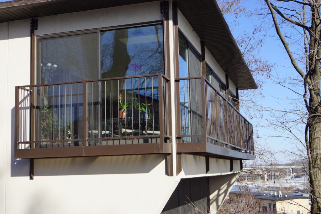 Home, tree, balcony and the sky