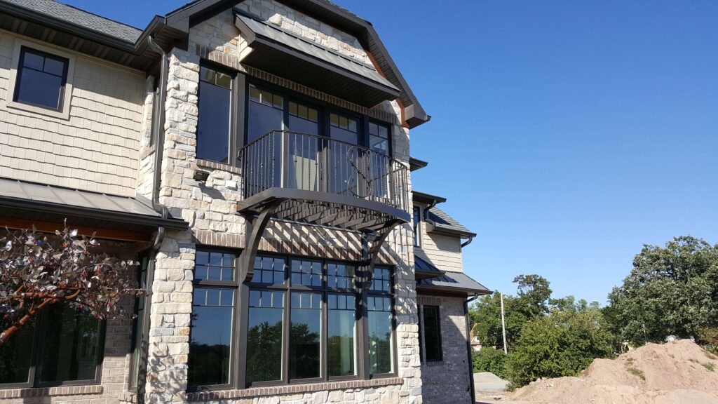Home with grey walls and a balcony