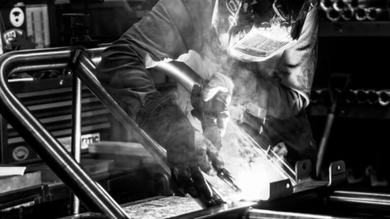 Black and White Photo of Man Welding at P&D Metal Works