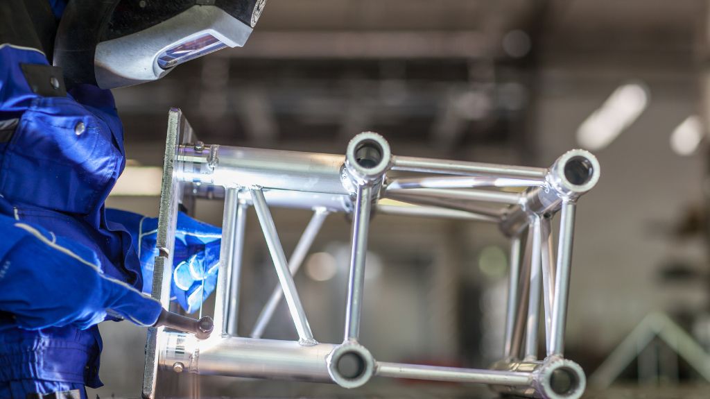 Welder Working on Metal Tubing