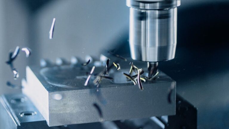 Close Up of Metal Drill Press with Metal Shavings