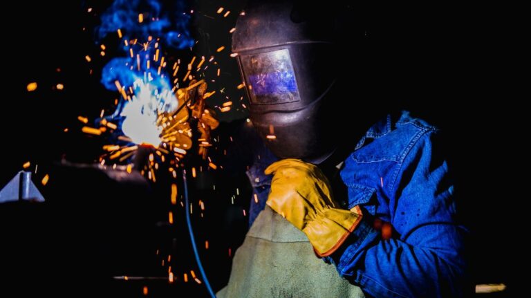 Man in Blue Welding