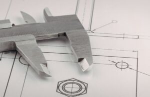 Close Up of CAD Blueprint with Measuring Device